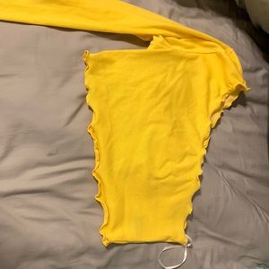 I’m selling a yellow, off the shoulder crop top